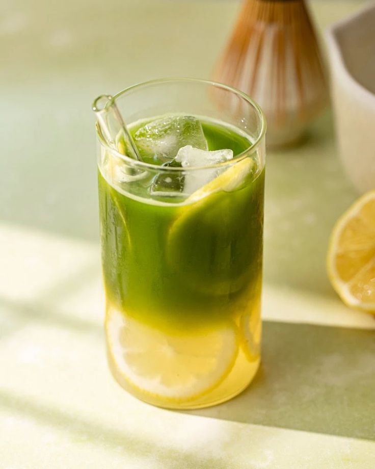 Sparkling citrus matcha drink with lime slices and mint made with Matcha Ujiro
